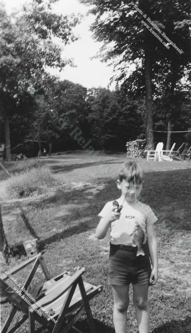 Fred Murray II fishing at lake cabin